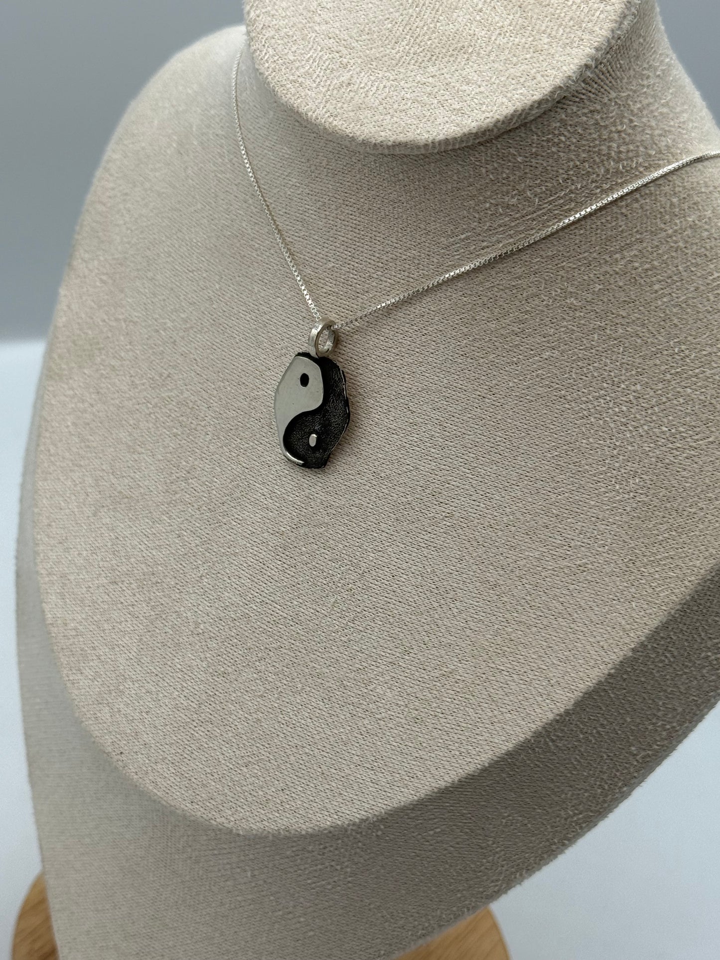 Elongated yin yang pendant