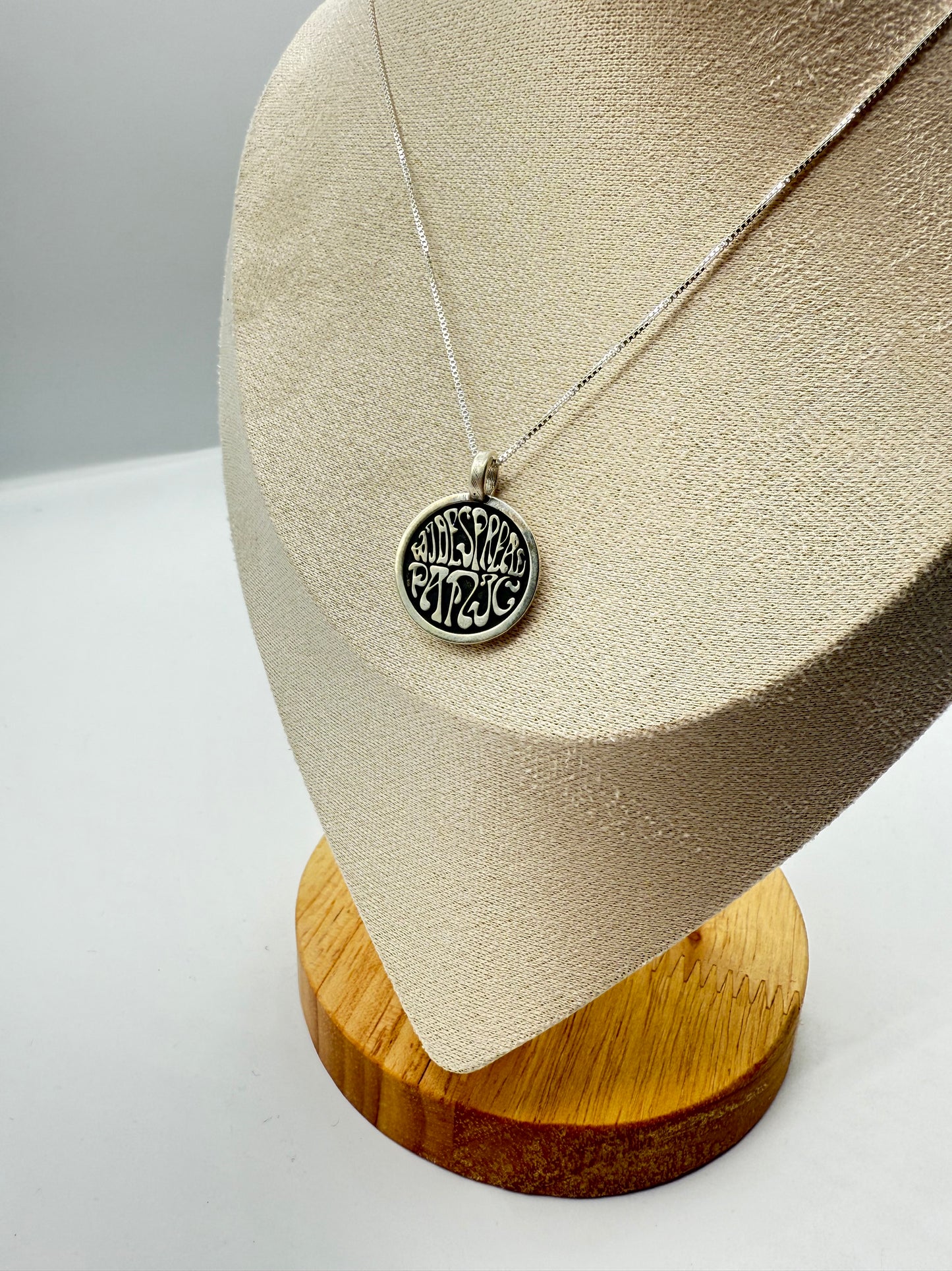 widespread circle logo in sterling silver
