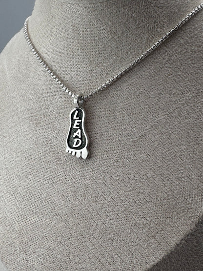 lead foot sterling silver pendant