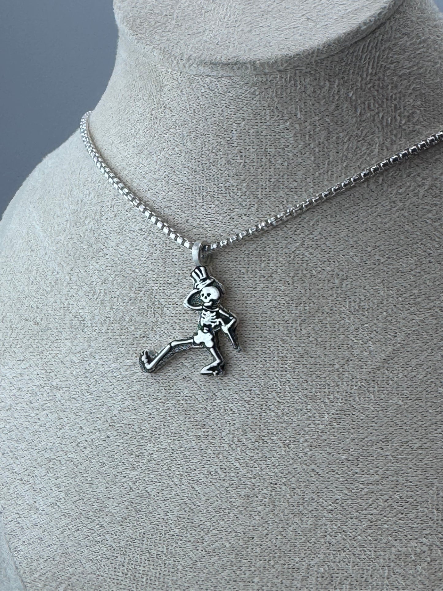 dancing skeleton pendant